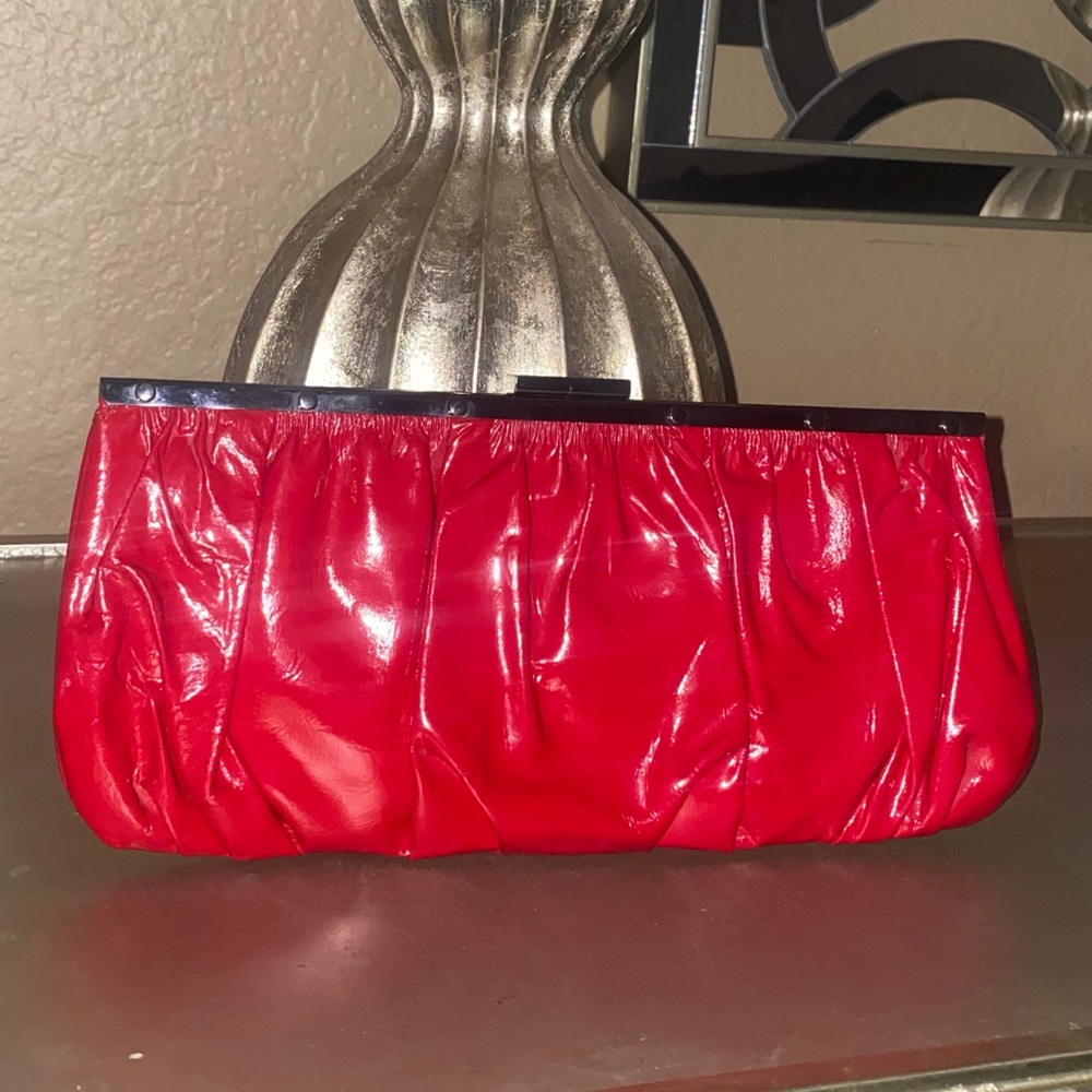 Perlina red patent leather clutch